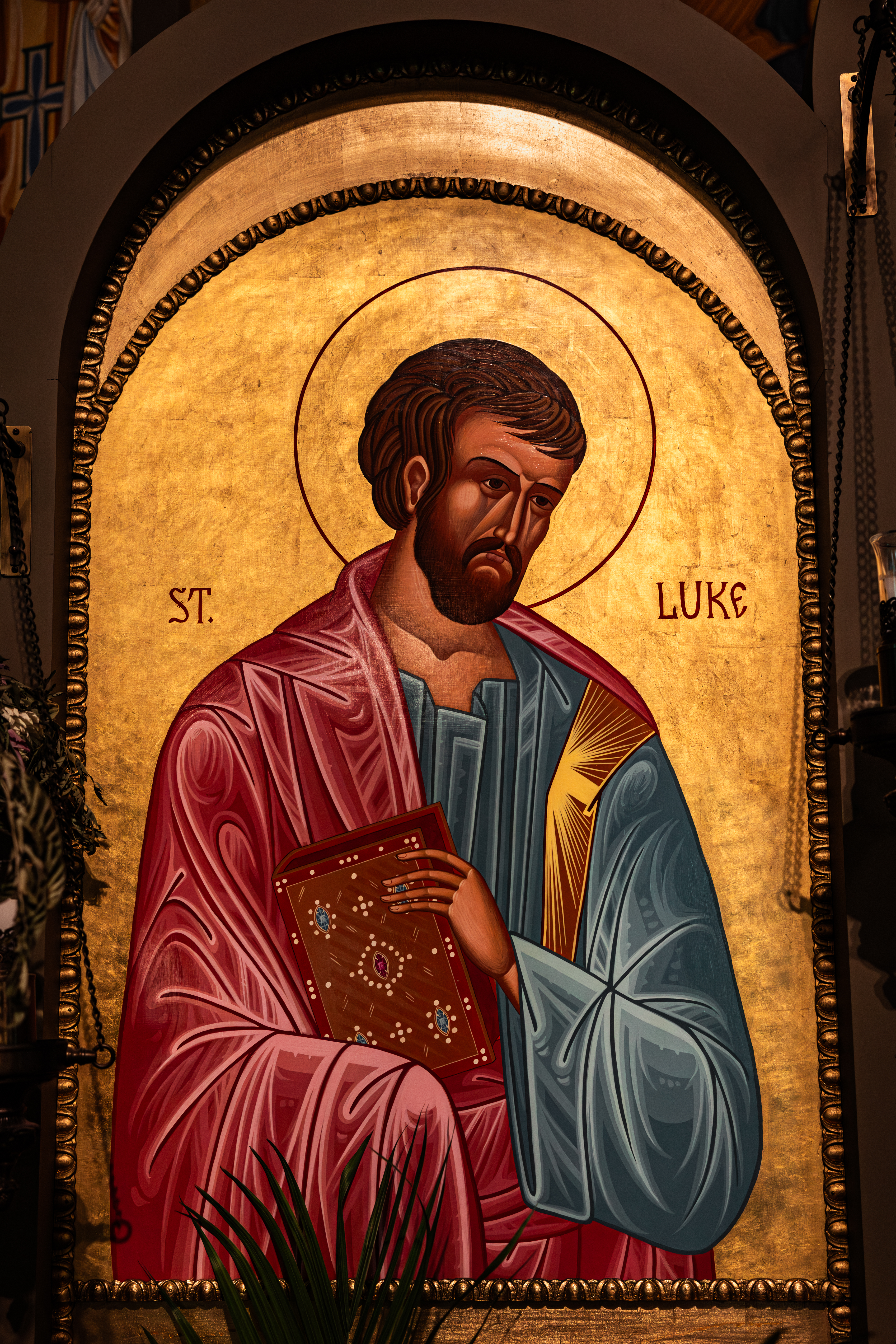 Parish icon of St. Luke the Apostle and Evangelist holding the Gospel