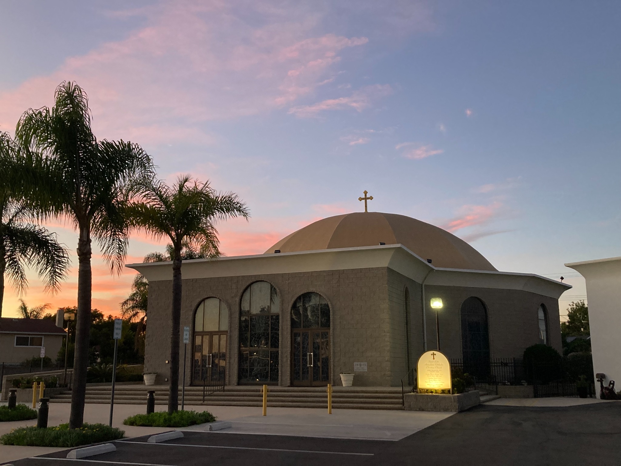 St. Luke Orthodox Church at sunset with palm trees